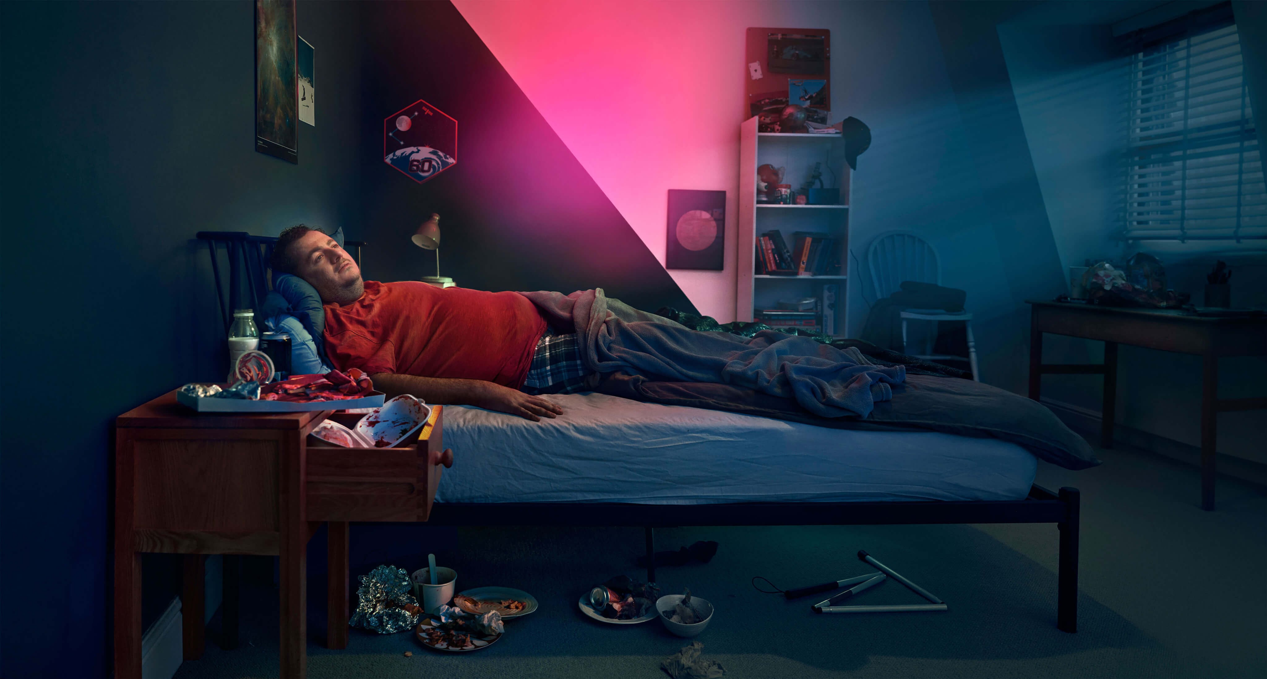 Man laying in a bed. Actor portrayal.