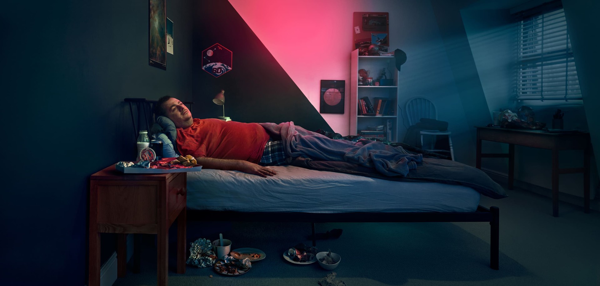 Man laying in a bed. Actor portrayal.